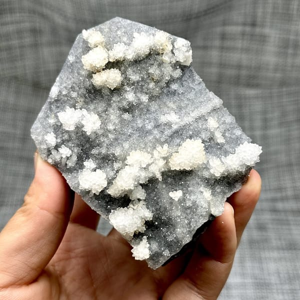 Hexagonal calcite with fluorite and quartz, from Fujian, China, front view in daylight, view 12 of 12