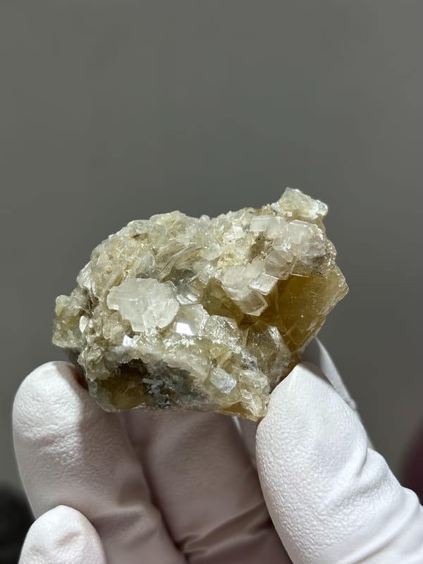 Honey scheelite with white calcite and mica from Xuebaoding, Sichuan, China, second angle