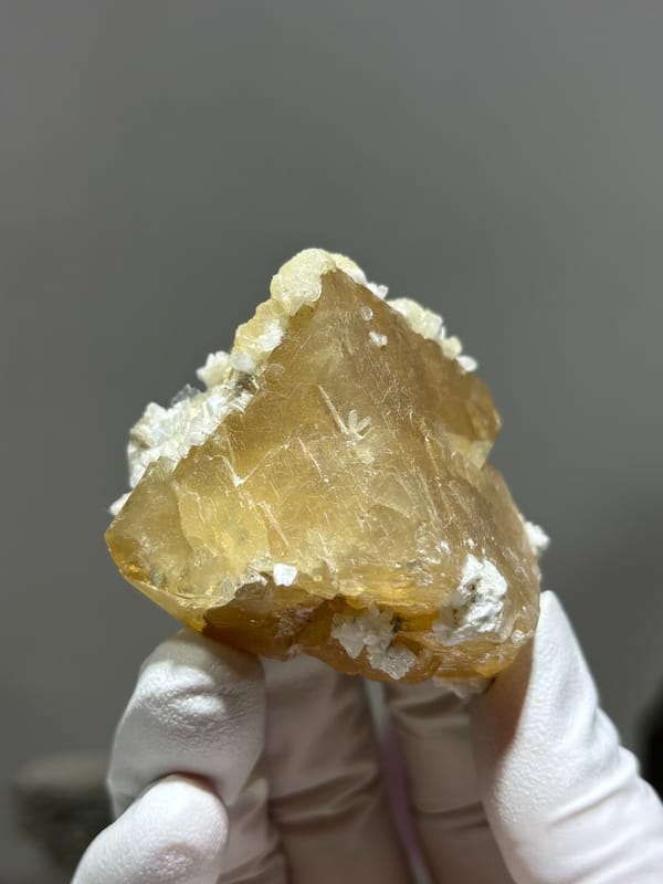Large honey scheelite with white calcite from Xuebaoding, Sichuan, China, second angle