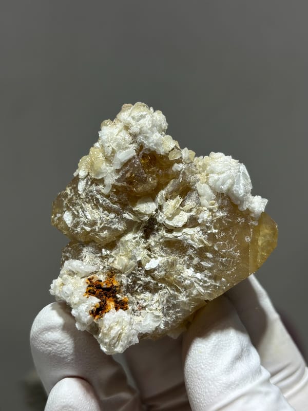 Large honey scheelite with white calcite from Xuebaoding, Sichuan, China, reverse side
