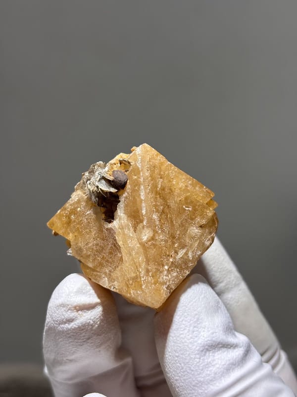 Honey scheelite with dark mica cap from Xuebaoding, Sichuan, China, view 3 of 5