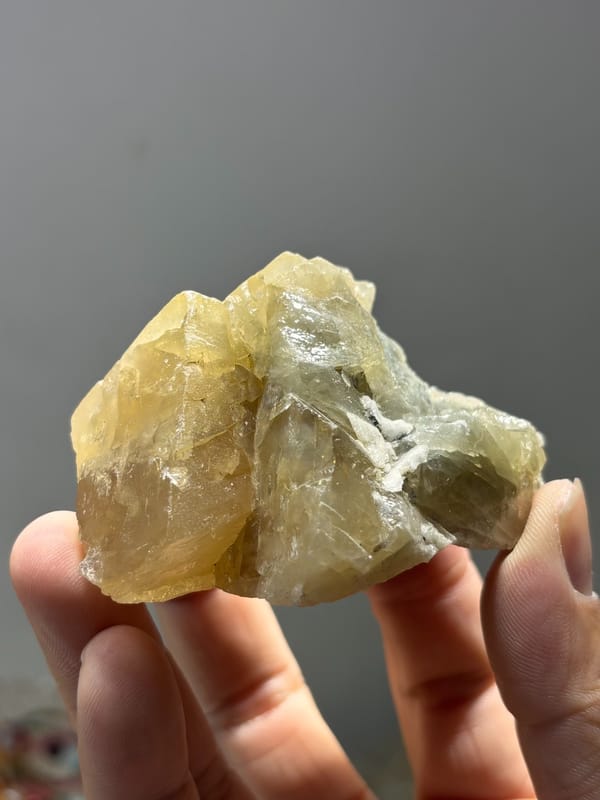 Honey scheelite group shaped like snow peak from Xuebaoding, Sichuan, China, close-up of the crystal faces