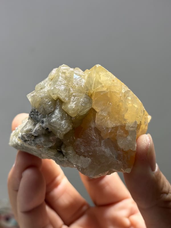 Honey scheelite group shaped like snow peak from Xuebaoding, Sichuan, China, reverse side