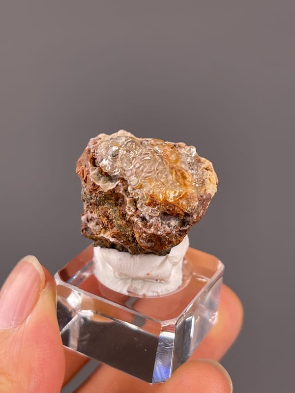 Hyalite Opal from Mexico: transparent hyalite along the upper matrix surface.