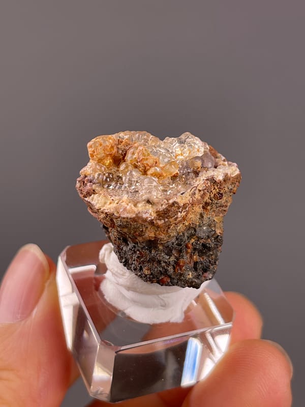 Hyalite Opal from Mexico: angled view of the layered brown matrix.