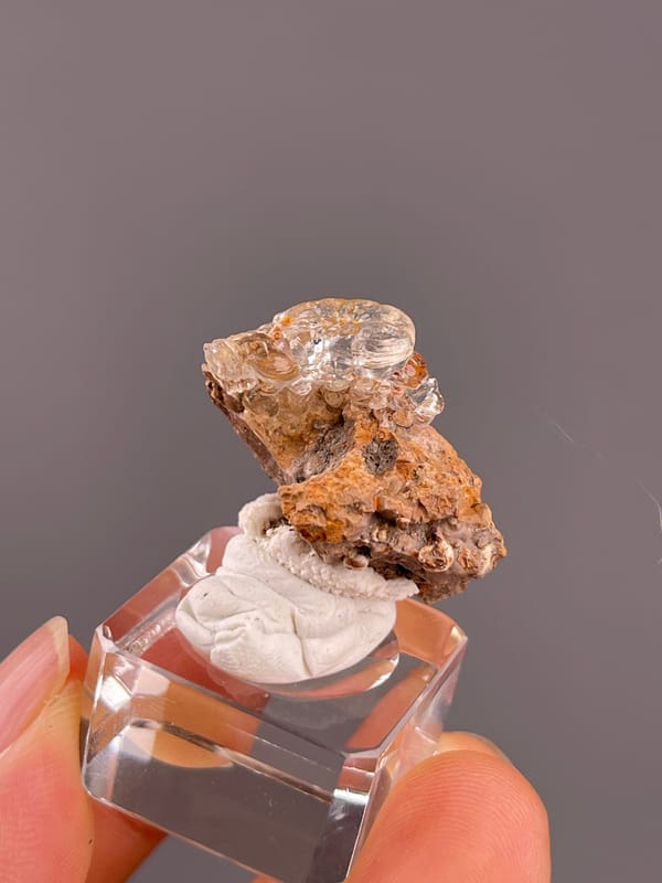 Hyalite Opal from Mexico: side profile of clear rounded hyalite.