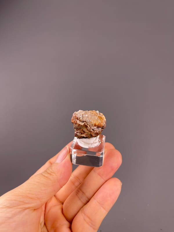 Hyalite Opal from Mexico: whole mounted specimen above the palm.