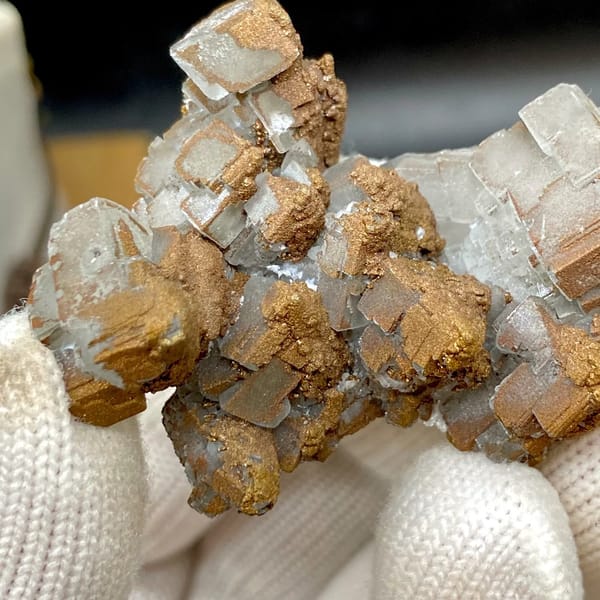 Iceland spar calcite rhombs half-coated in rusty iridescent pyrite from Hunan, China, view 5 of 9