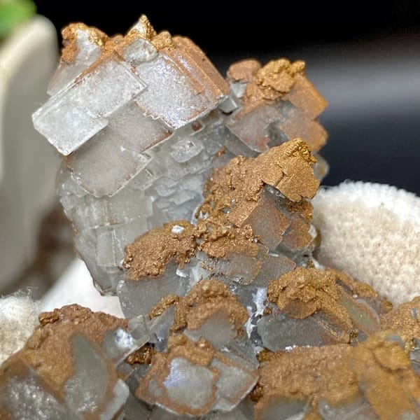 Iceland spar calcite rhombs half-coated in rusty iridescent pyrite from Hunan, China, view 8 of 9