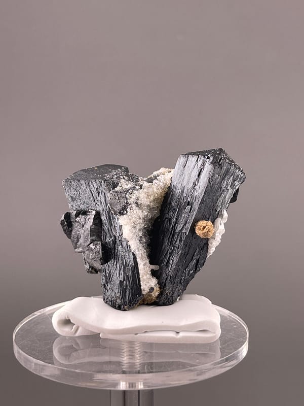 Ilvaite specimen from Inner Mongolia, China showing black striated prismatic crystals