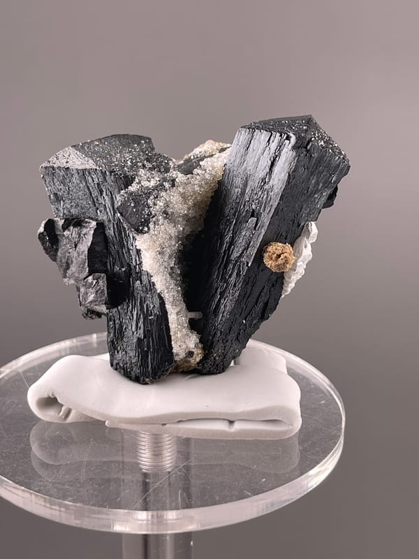 Ilvaite specimen from Inner Mongolia, China presenting black striated prismatic crystals