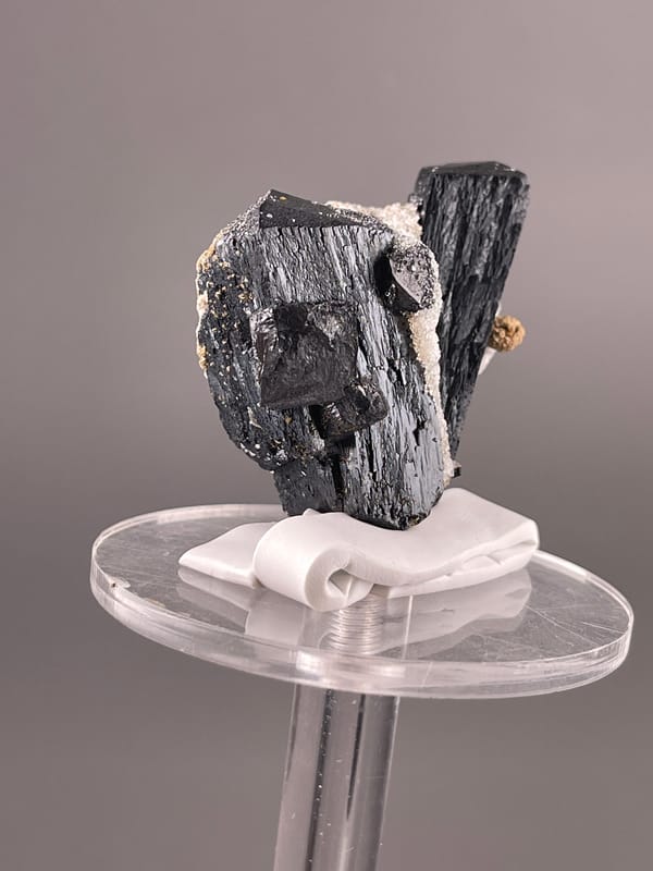 Black striated prismatic crystals visible on ilvaite specimen from Inner Mongolia, China