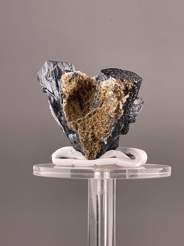 Ilvaite specimen from Inner Mongolia, China displaying black striated prismatic crystals