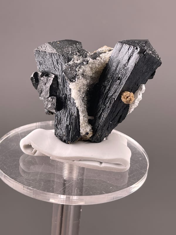 Ilvaite specimen from Inner Mongolia, China highlighting black striated prismatic crystals