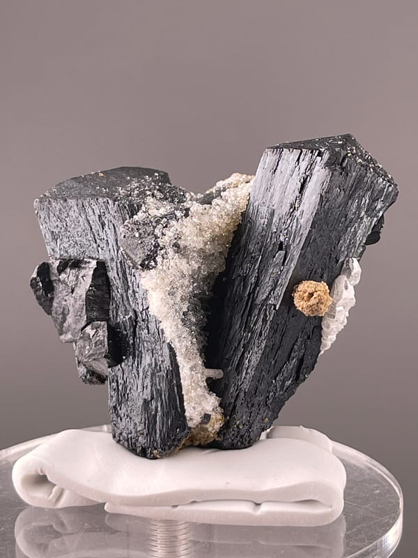 Ilvaite specimen from Inner Mongolia, China, characterized by black striated prismatic crystals