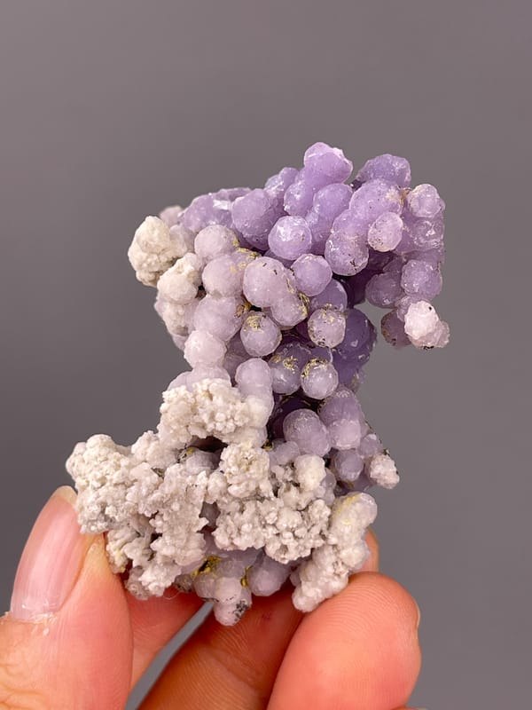 Grape Agate specimen from Indonesia featuring lavender botryoidal chalcedony spheres