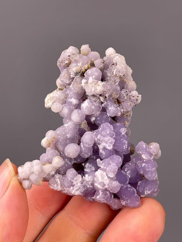 Grape Agate specimen from Indonesia presenting lavender botryoidal chalcedony spheres