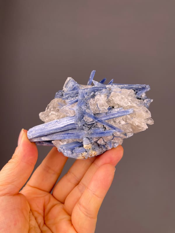 Kyanite specimen from Brazil bearing blue striated blades in quartz