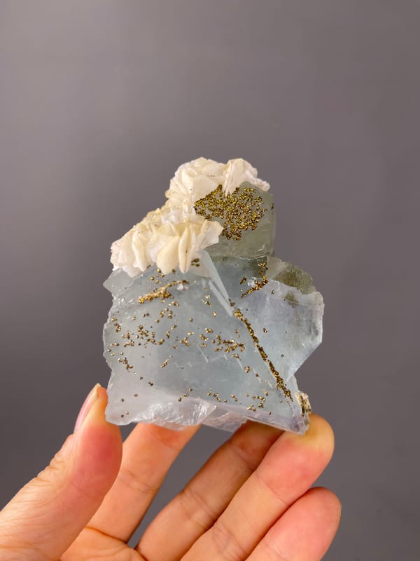 Light Blue Fluorite specimen from Yaogangxian Mine, Hunan, China featuring pale blue cleavage faces with pyrite