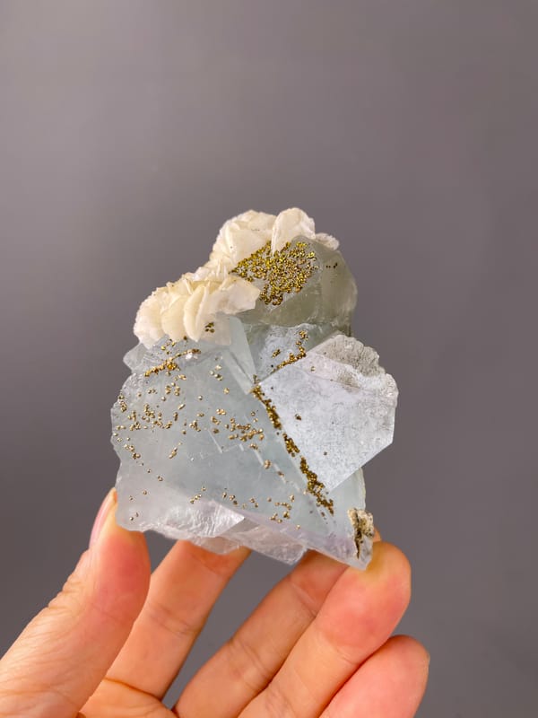 Light Blue Fluorite, Yaogangxian Mine, Hunan, China, defined by pale blue cleavage faces with pyrite