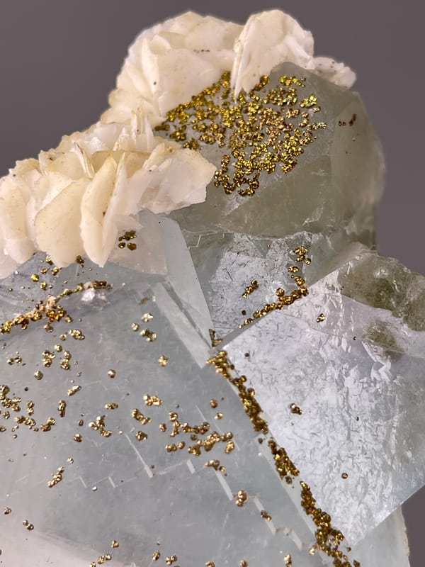 Light Blue Fluorite specimen from Yaogangxian Mine, Hunan, China presenting pale blue cleavage faces with pyrite