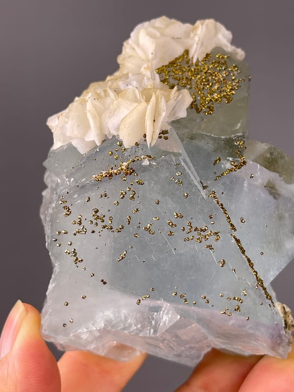Pale blue cleavage faces with pyrite on light blue fluorite, Yaogangxian Mine, Hunan, China