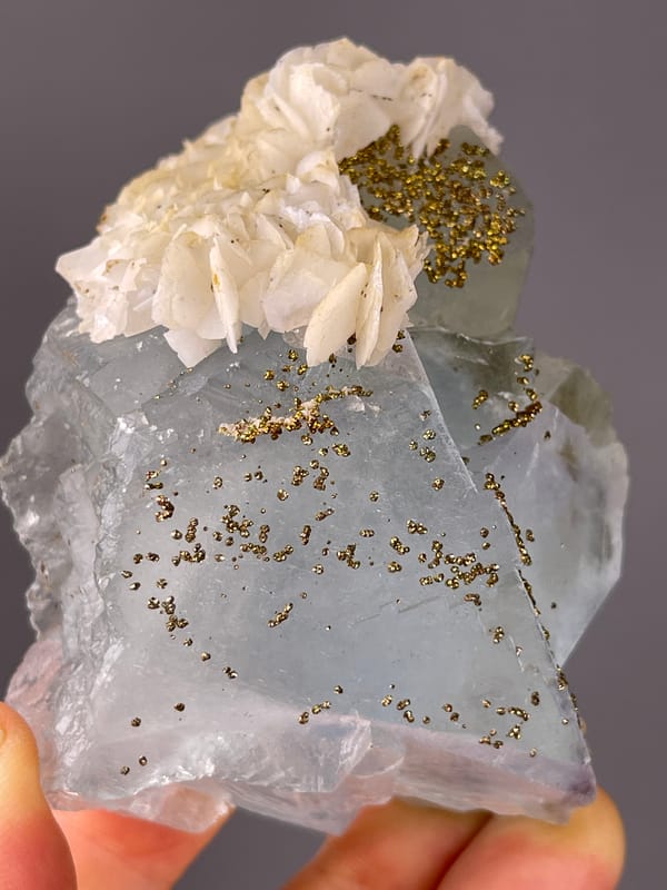 Light Blue Fluorite specimen from Yaogangxian Mine, Hunan, China highlighting pale blue cleavage faces with pyrite