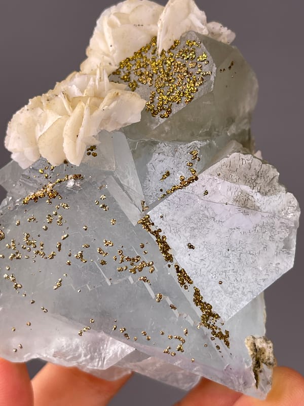 Light Blue Fluorite specimen from Yaogangxian Mine, Hunan, China bearing pale blue cleavage faces with pyrite