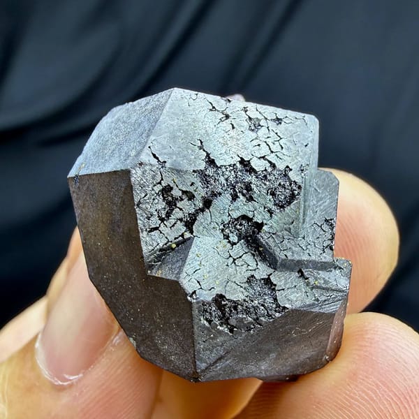 Bright etched magnetite crystal on garnet and epidote from Inner Mongolia, China, view 4 of 6