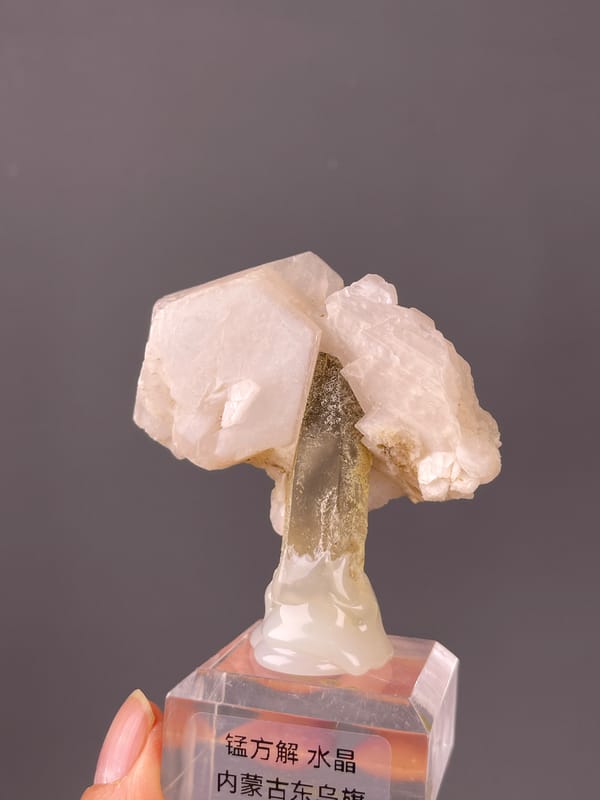 Pale pink calcite and smoky quartz on natural manganese-bearing calcite, Dong Ujimqin Banner, Inner Mongolia, China