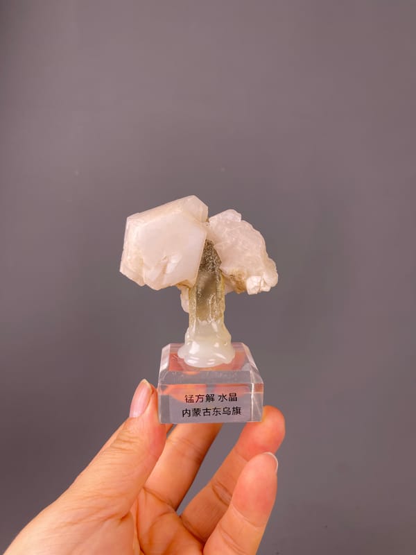 Manganese-bearing Calcite, Dong Ujimqin Banner, Inner Mongolia, China, showcasing pale pink calcite and smoky quartz