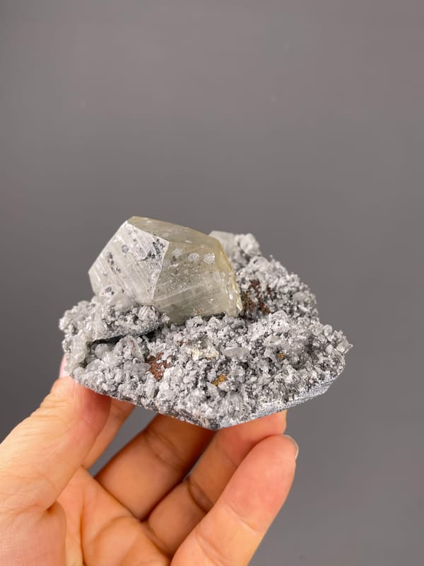 Mercedes-head Calcite specimen from Fujian, China showing pale beige crystal on gray druse