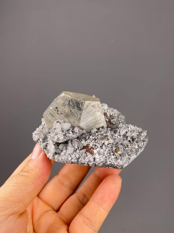 Mercedes-head Calcite specimen from Fujian, China, defined by pale beige crystal on gray druse