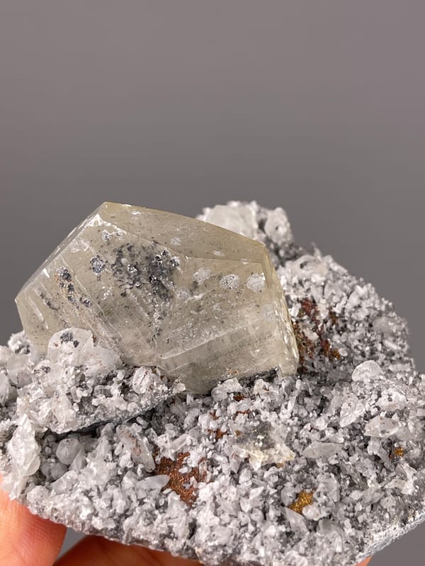 Mercedes-head Calcite specimen from Fujian, China displaying pale beige crystal on gray druse