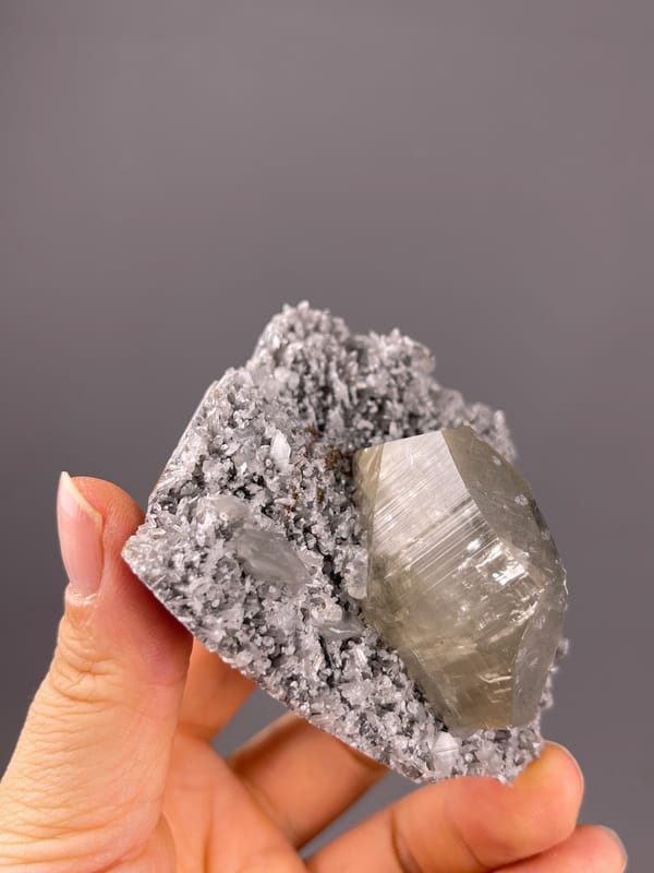 Mercedes-head Calcite specimen from Fujian, China highlighting pale beige crystal on gray druse