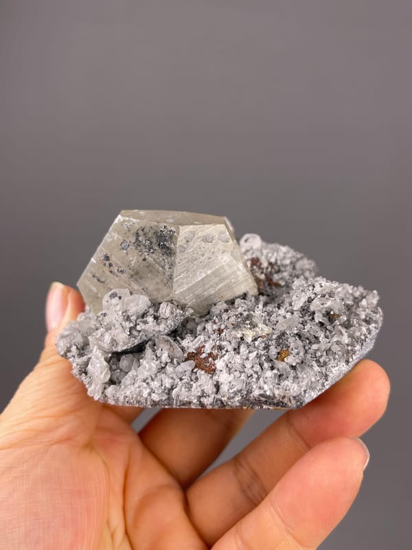 Mercedes-head Calcite specimen from Fujian, China, characterized by pale beige crystal on gray druse