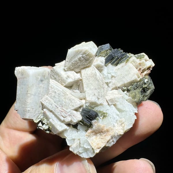 Blocky cream feldspar crystals with dark green mica from Yunxiao, Fujian, China, view 2 of 6