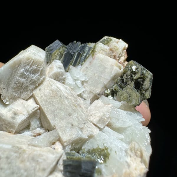 Blocky cream feldspar crystals with dark green mica from Yunxiao, Fujian, China, view 3 of 6