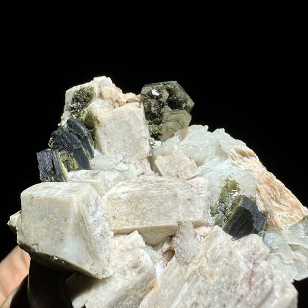 Blocky cream feldspar crystals with dark green mica from Yunxiao, Fujian, China, view 4 of 6
