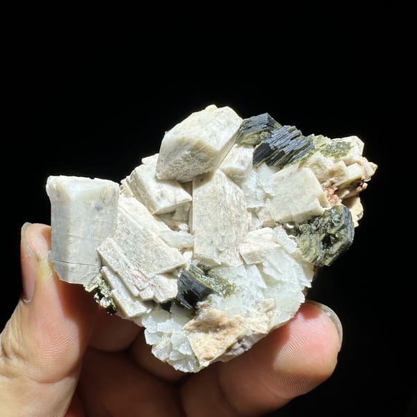 Blocky cream feldspar crystals with dark green mica from Yunxiao, Fujian, China, view 5 of 6
