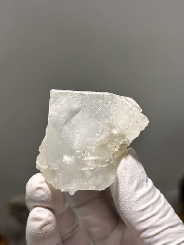 Milky white fluorite cube from Xuebaoding, Sichuan, China, close-up of the crystal faces