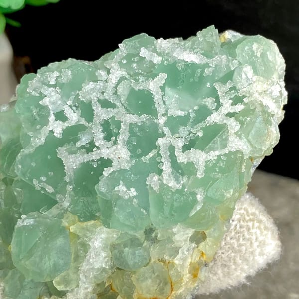 Mint-green sugar fluorite with white druse network from Fujian, China, view 5 of 9