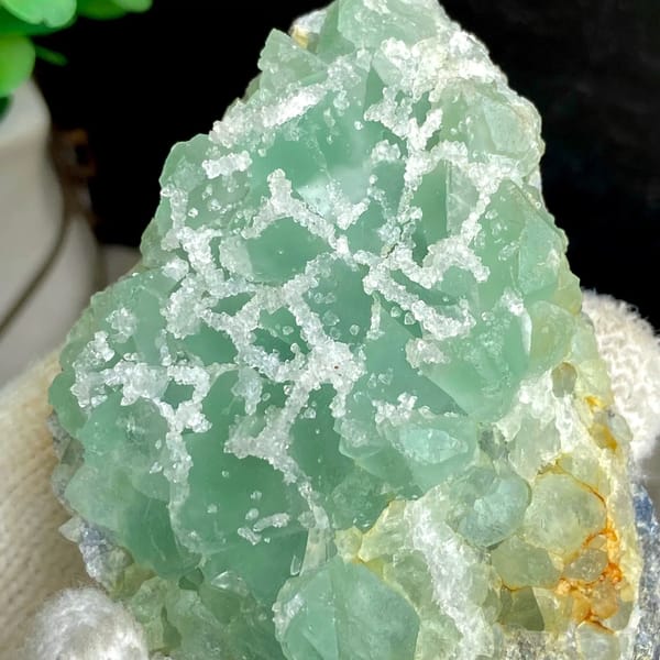 Mint-green sugar fluorite with white druse network from Fujian, China, view 8 of 9