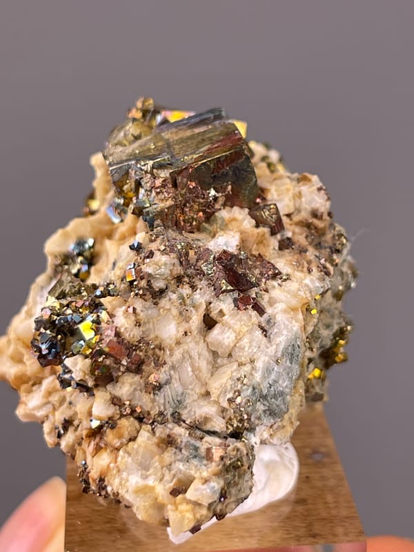 Brassy mirror-luster metallic crystals visible on mirror-luster pyrite specimen from Shangbao Mine, Hunan, China
