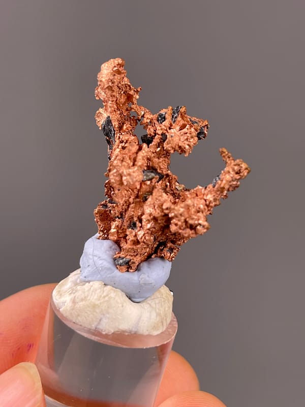 Branching copper-red metallic mass visible on native copper specimen from Jiangxi, China
