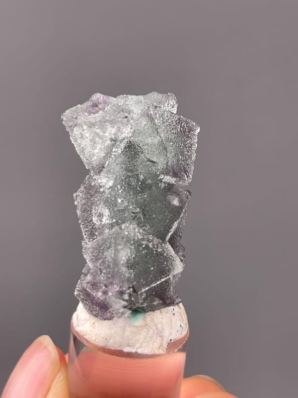 Gray-purple fluorite with frosted faces on natural octahedral fluorite specimen from Sanming, Fujian, China