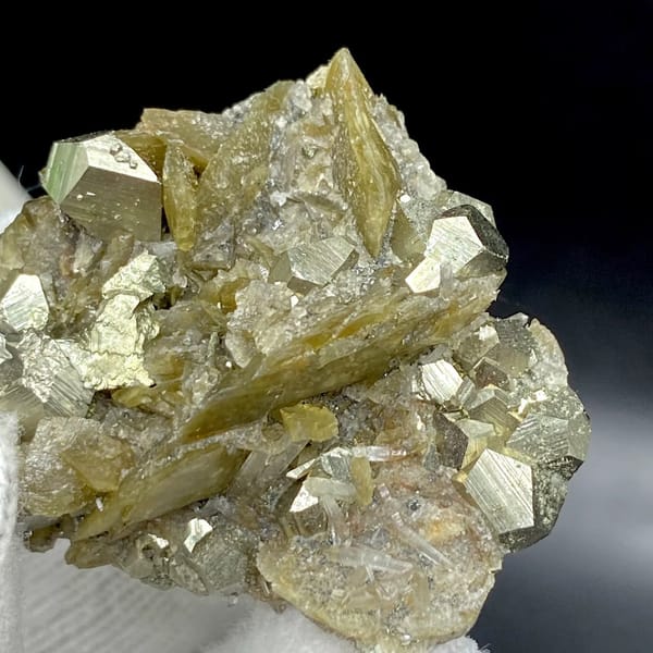 Olive siderite blades studded with pyrite dodecahedra from Guizhou, China, view 9 of 9