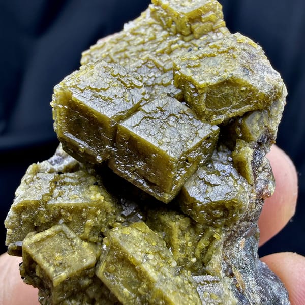 Olive-green grossular garnet dodecahedra with calcite from Inner Mongolia, China, view 4 of 6