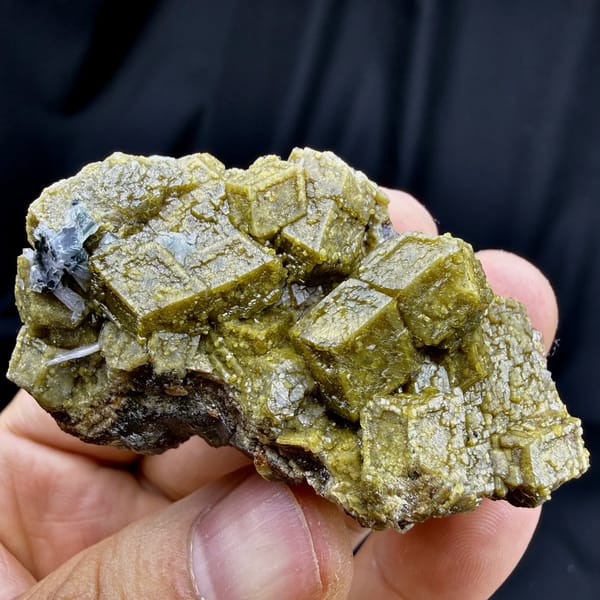 Olive-green grossular garnet dodecahedra with calcite from Inner Mongolia, China, view 5 of 6