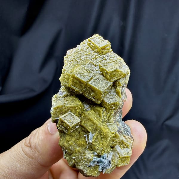 Olive-green grossular garnet dodecahedra with calcite from Inner Mongolia, China, view 6 of 6